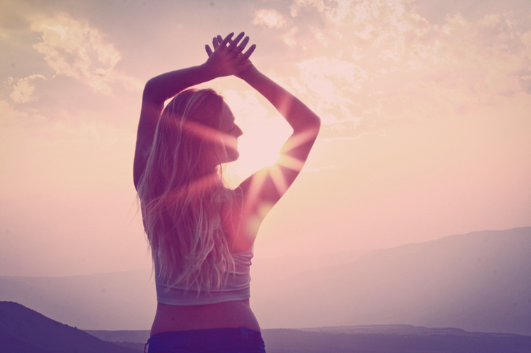 hands above head turned sunset